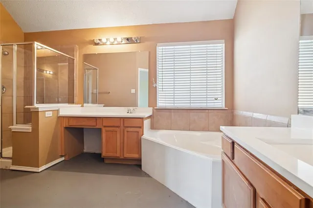a bathroom with a bathtub a sink and a window