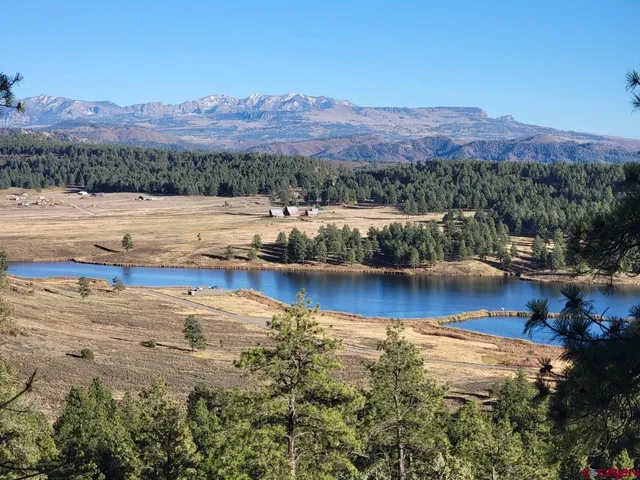 a view of a lake with mountains in the background