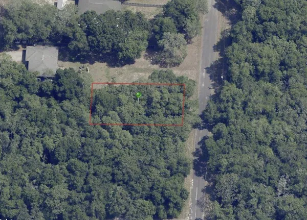 an aerial view of residential house with outdoor space