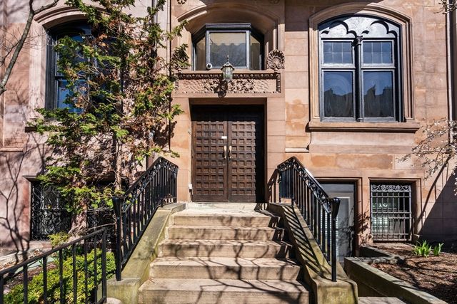 an entrance to house with yard