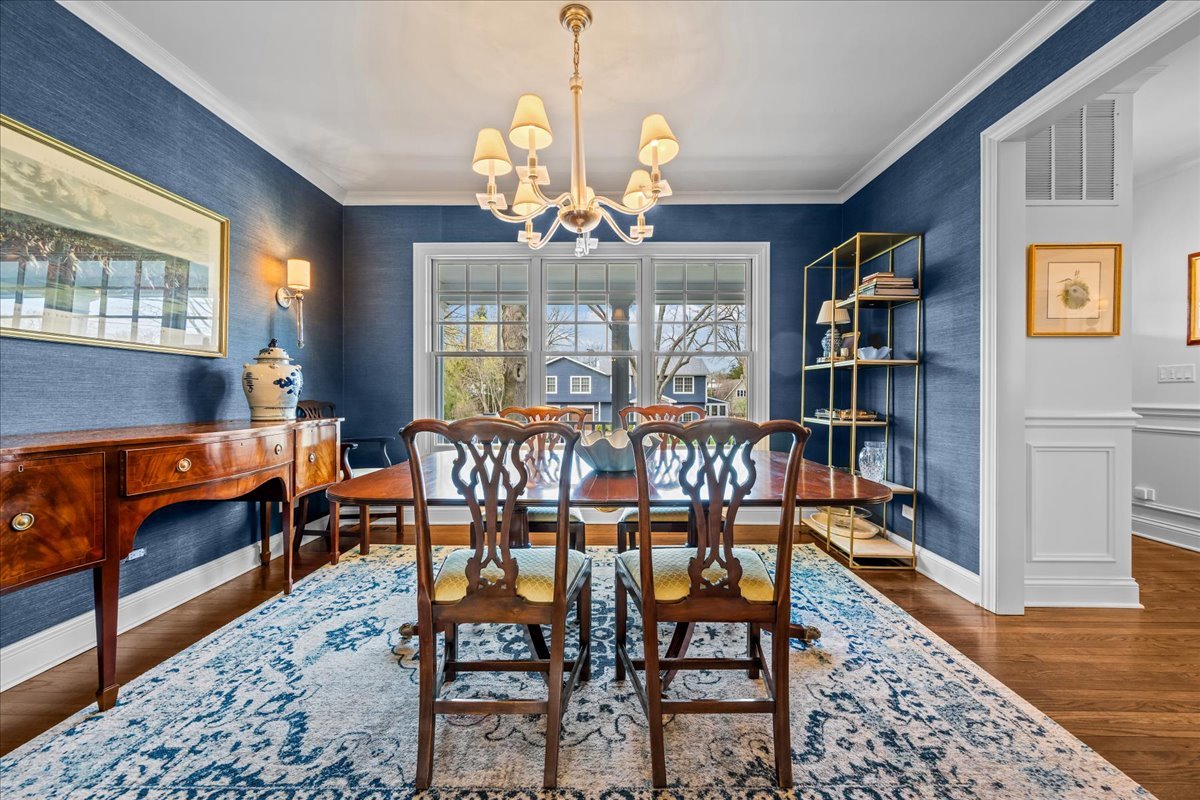 129 Ravine Forest Drive Lake Bluff, IL 60044 - Photo 12 of 50 a view of a dining room with furniture wooden floor and chandelier