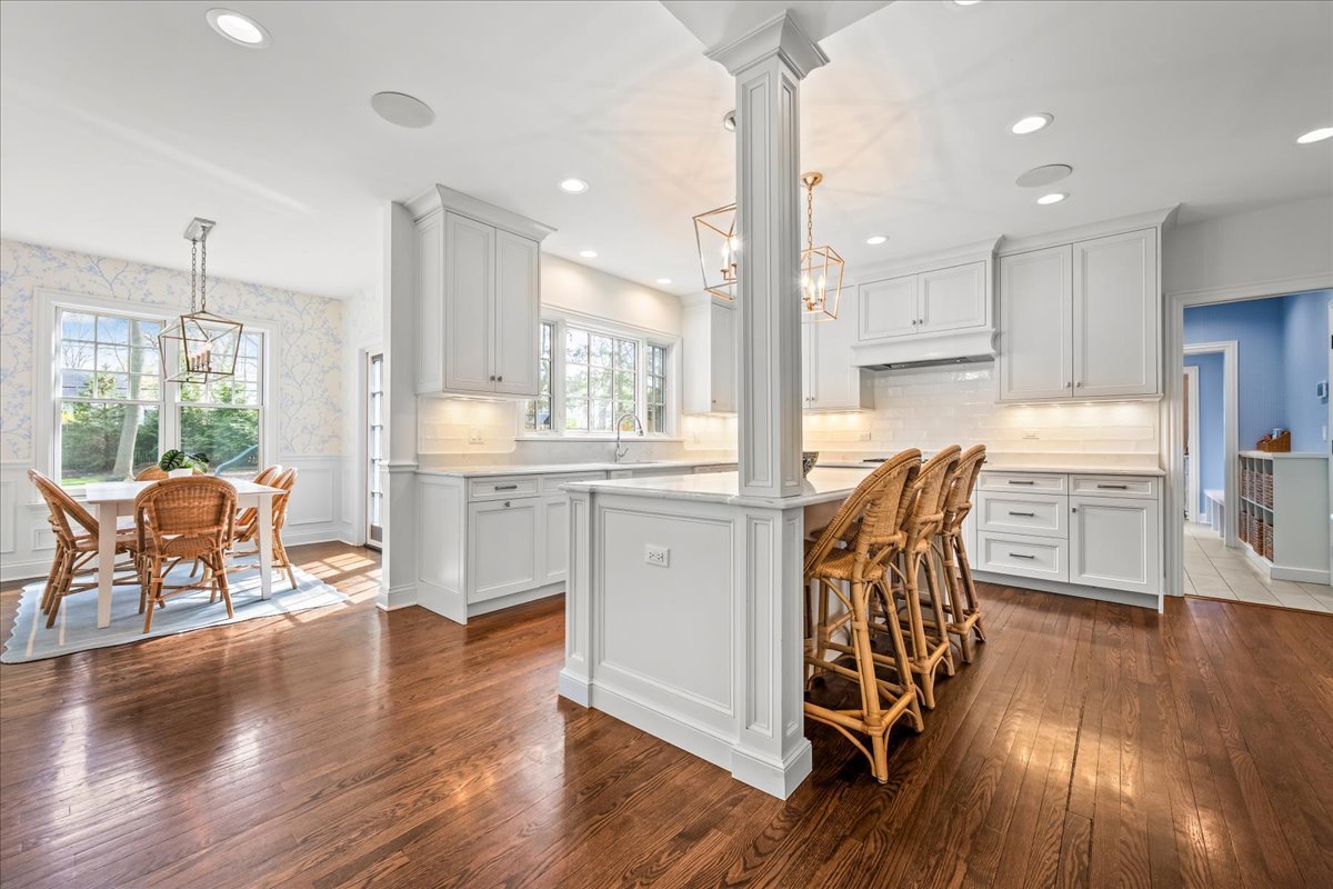 129 Ravine Forest Drive Lake Bluff, IL 60044 - Photo 16 of 50 a kitchen with stainless steel appliances wooden floors and wooden floors