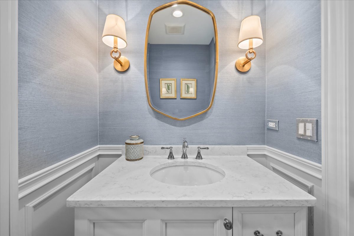 129 Ravine Forest Drive Lake Bluff, IL 60044 - Photo 27 of 50 a bathroom with a sink and mirror