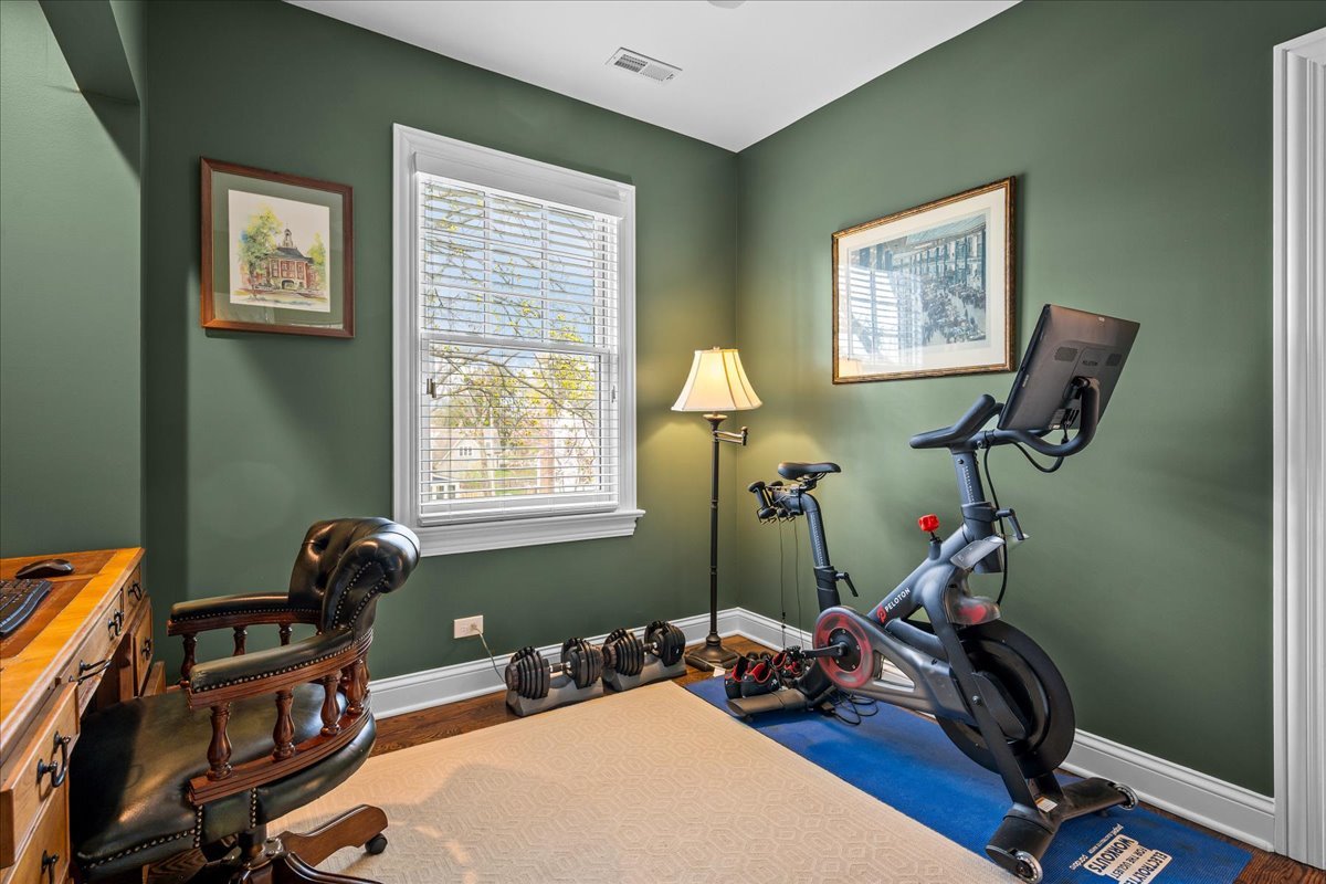 129 Ravine Forest Drive Lake Bluff, IL 60044 - Photo 38 of 50 a room with gym equipment and windows