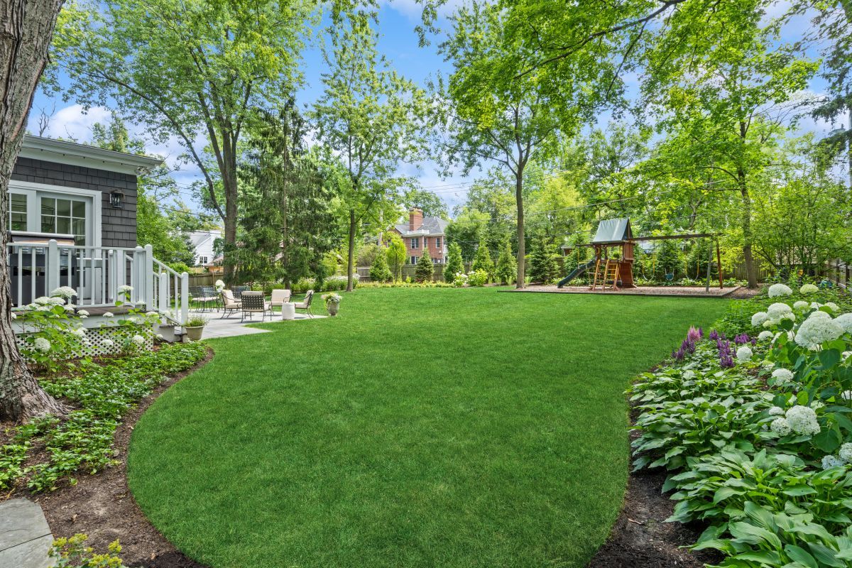 129 Ravine Forest Drive Lake Bluff, IL 60044 - Photo 50 of 50 a view of a house with a big yard and large trees
