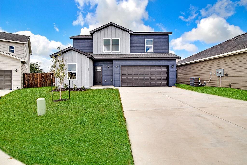 620 Alameda Road Azle, TX 76020 - Photo 1 of 27 a front view of a house with a yard and garage