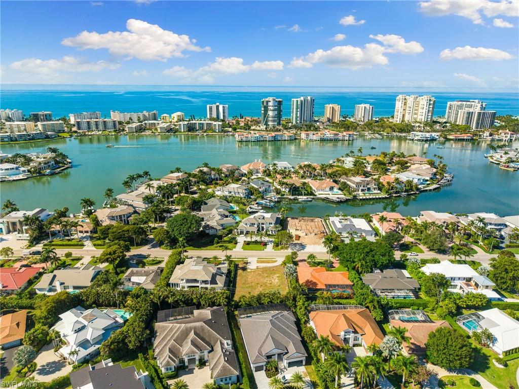 3670 Crayton Road Naples, FL 34103 - Photo 12 of 12 a view of a lake with a city