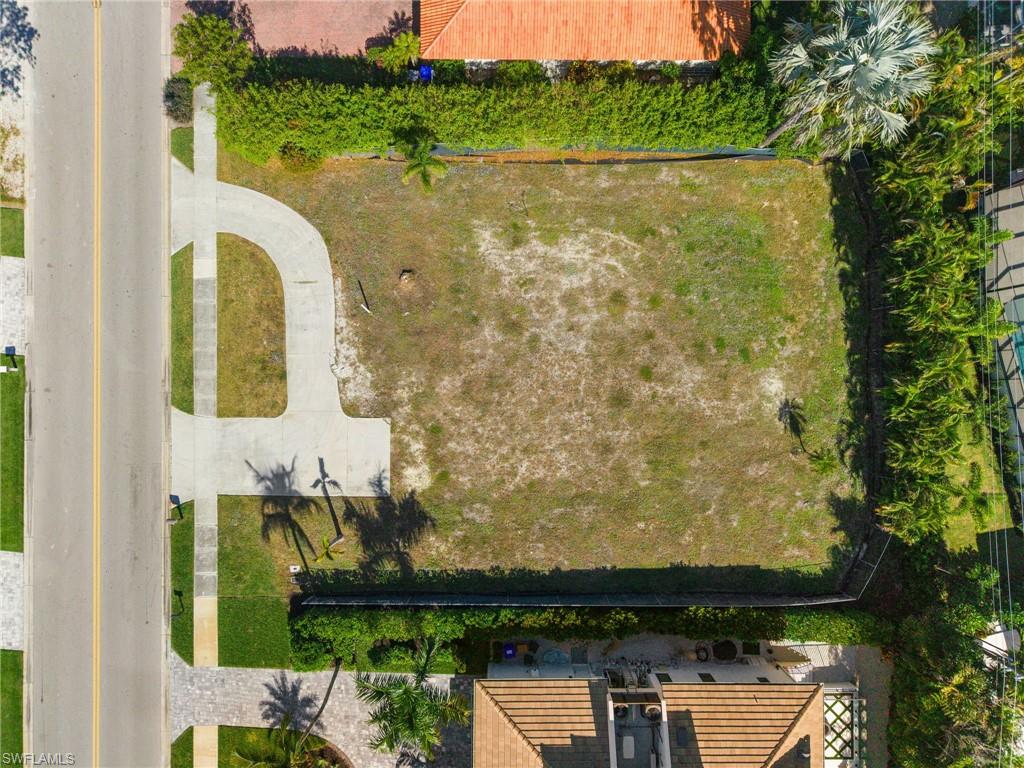 3670 Crayton Road Naples, FL 34103 - Photo 2 of 12 a view of a lake from a balcony