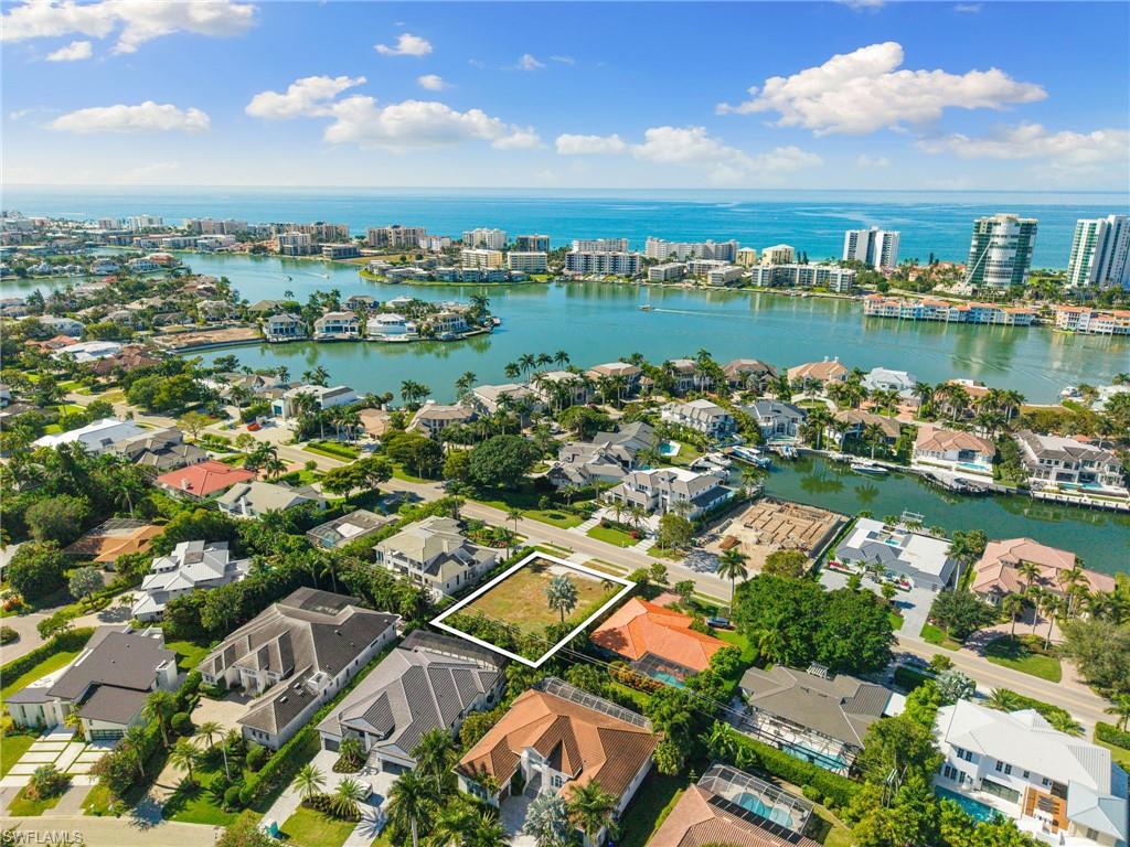3670 Crayton Road Naples, FL 34103 - Photo 8 of 12 an aerial view of a city with lake view