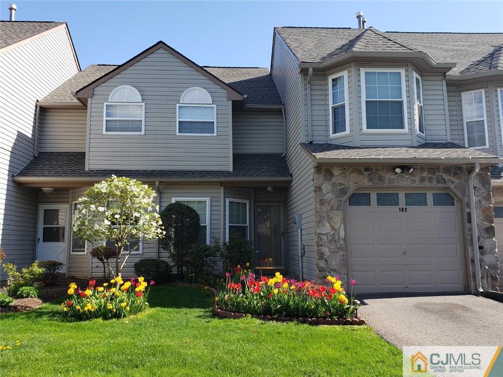 182 Nebula Road, Unit 182 Piscataway, NJ 08854 - Photo 1 of 23 a front view of a house with a yard and outdoor seating