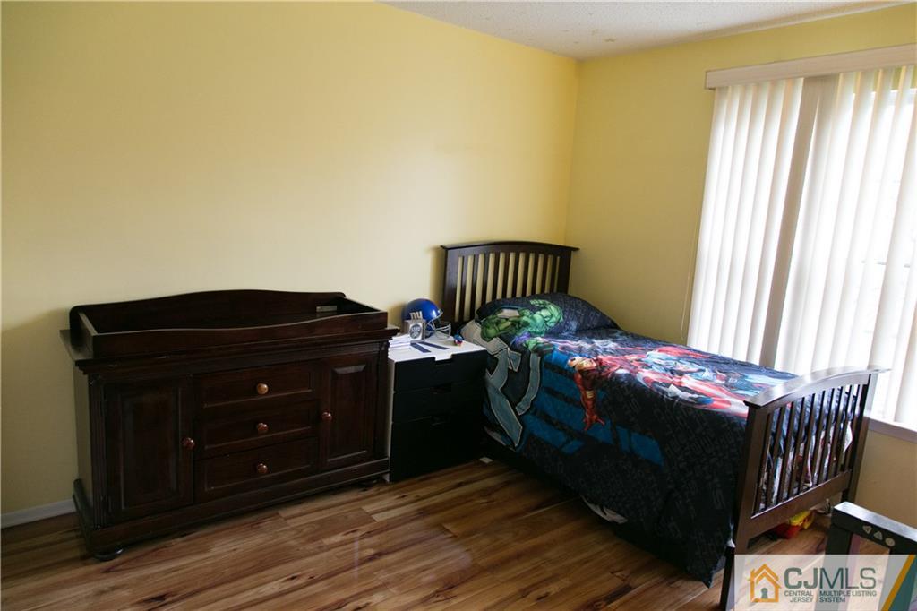 182 Nebula Road, Unit 182 Piscataway, NJ 08854 - Photo 14 of 23 a bedroom with a bed and window