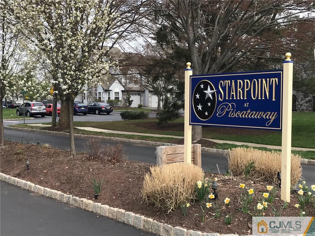 182 Nebula Road, Unit 182 Piscataway, NJ 08854 - Photo 16 of 23 a sign broad on the side of the road
