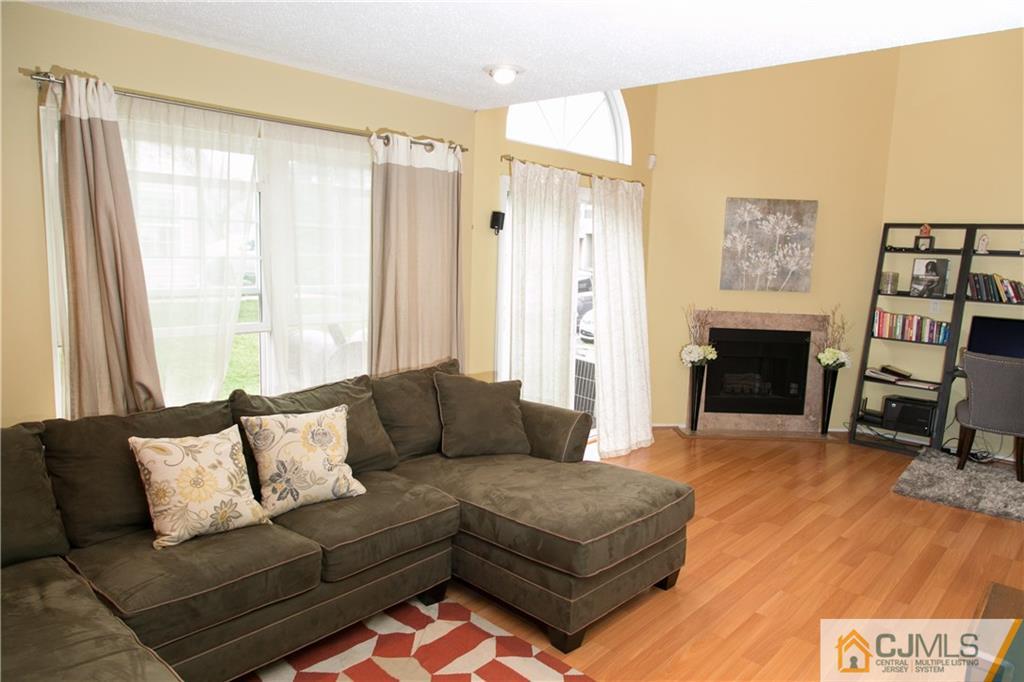 182 Nebula Road, Unit 182 Piscataway, NJ 08854 - Photo 5 of 23 a living room with furniture and a fireplace