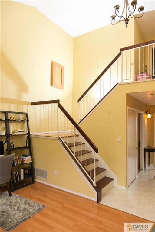 182 Nebula Road, Unit 182 Piscataway, NJ 08854 - Photo 10 of 23 a view of entryway and hall with wooden floor
