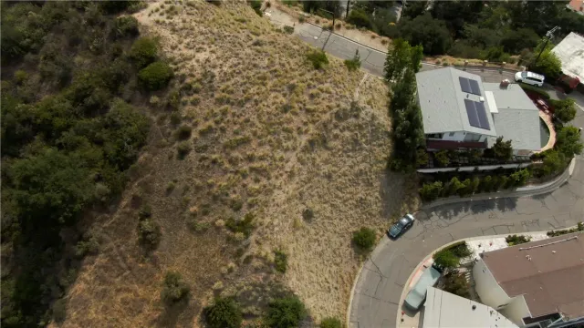 an aerial view of residential house with outdoor space