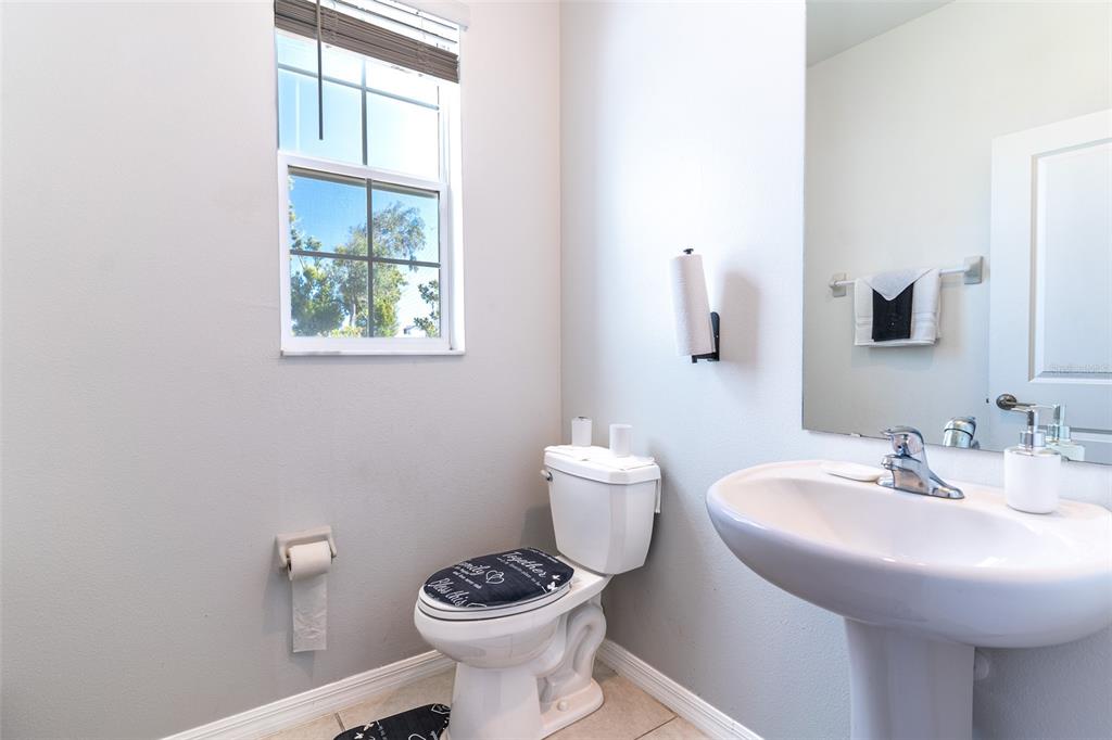 7014 Ripple Pond Loop Zephyrhills, FL 33541 - Photo 11 of 40 a bathroom with a sink and a toilet
