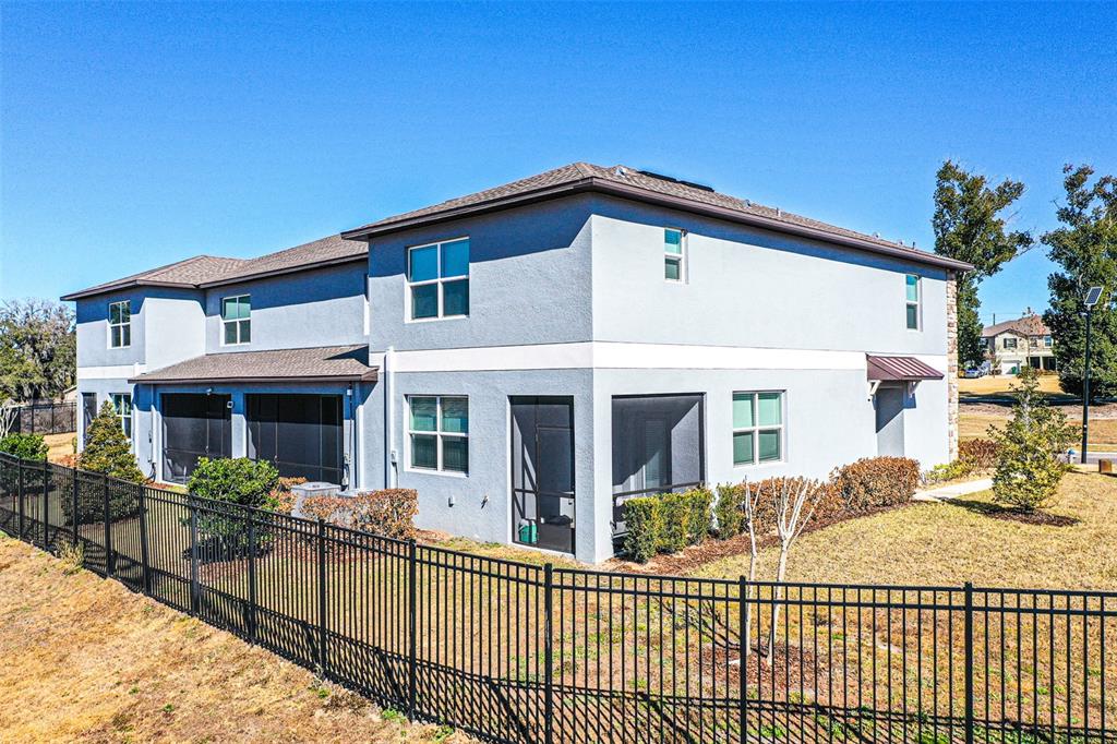 7014 Ripple Pond Loop Zephyrhills, FL 33541 - Photo 16 of 40 a view of a house with wooden floor and a small yard