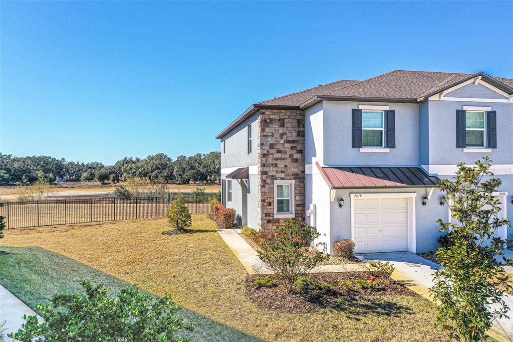 7014 Ripple Pond Loop Zephyrhills, FL 33541 - Photo 17 of 40 a house with river in front of it