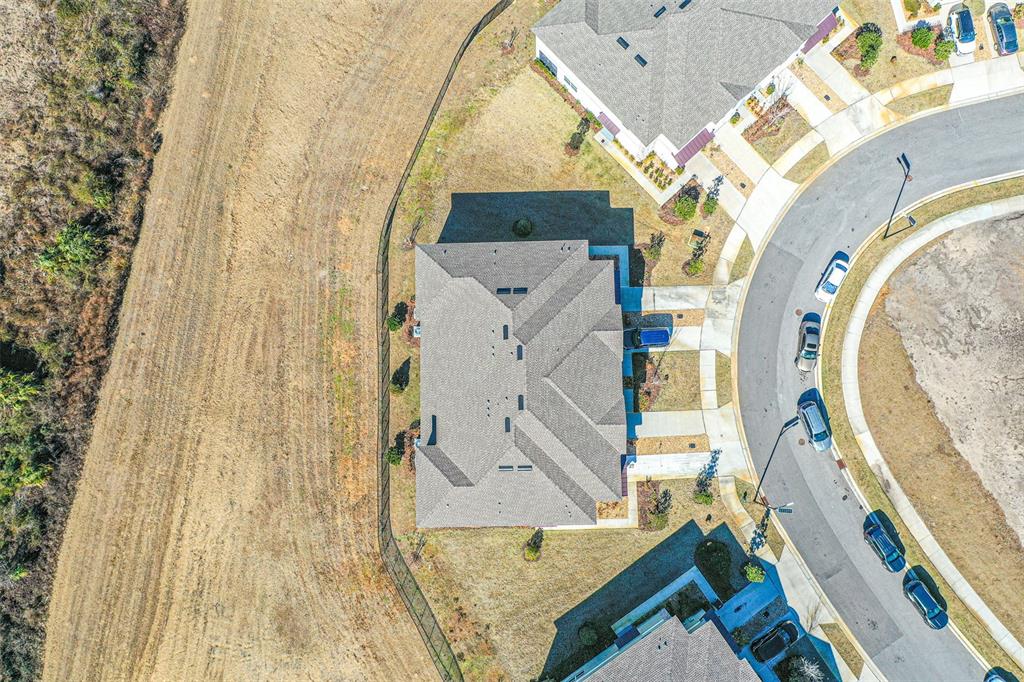 7014 Ripple Pond Loop Zephyrhills, FL 33541 - Photo 21 of 40 an aerial view of a house with a swimming pool