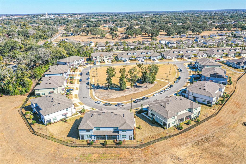 7014 Ripple Pond Loop Zephyrhills, FL 33541 - Photo 23 of 40 an aerial view of residential houses with outdoor space