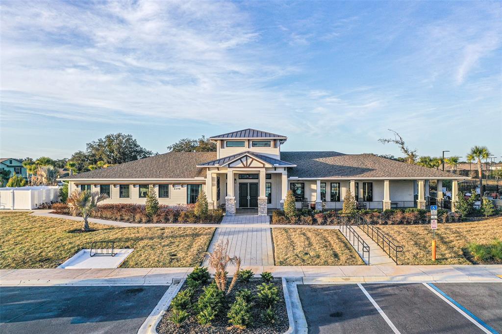 7014 Ripple Pond Loop Zephyrhills, FL 33541 - Photo 25 of 40 a front view of a house with a yard