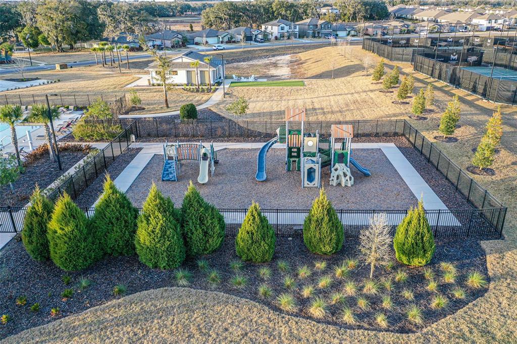 7014 Ripple Pond Loop Zephyrhills, FL 33541 - Photo 29 of 40 a view of a swimming pool with outdoor seating