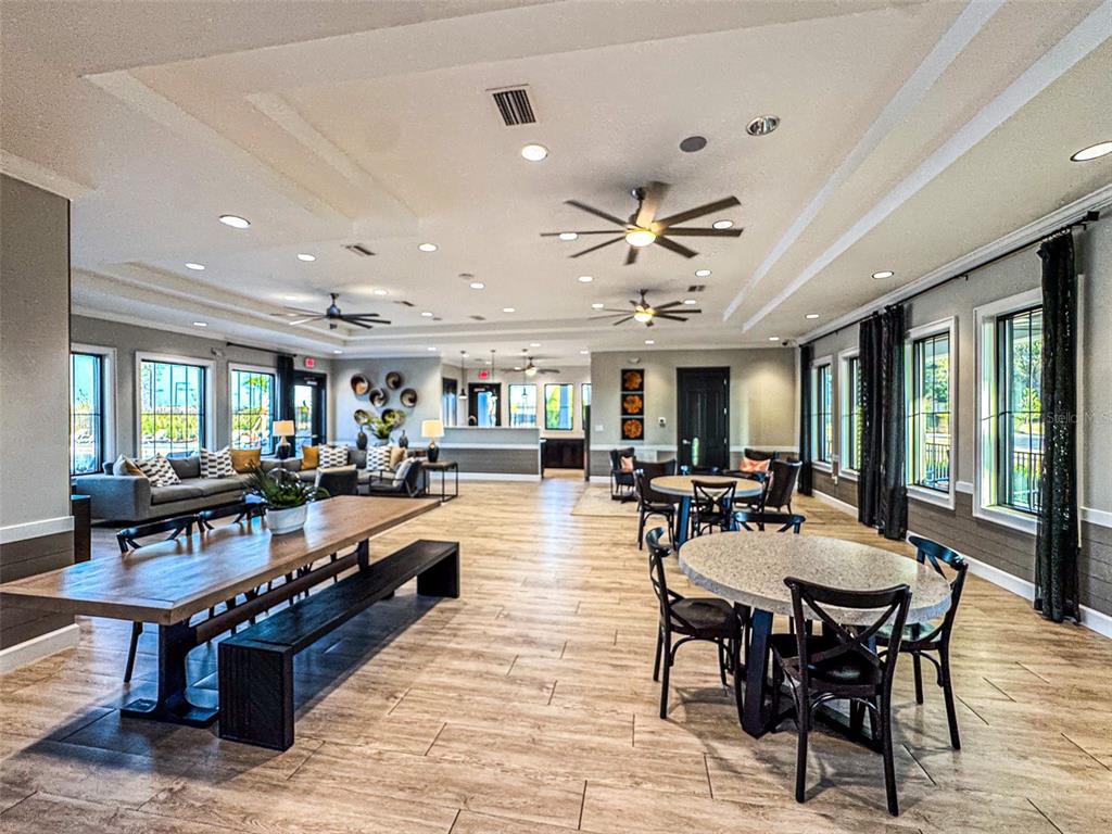 7014 Ripple Pond Loop Zephyrhills, FL 33541 - Photo 34 of 40 a view of a dining room with furniture window and wooden floor