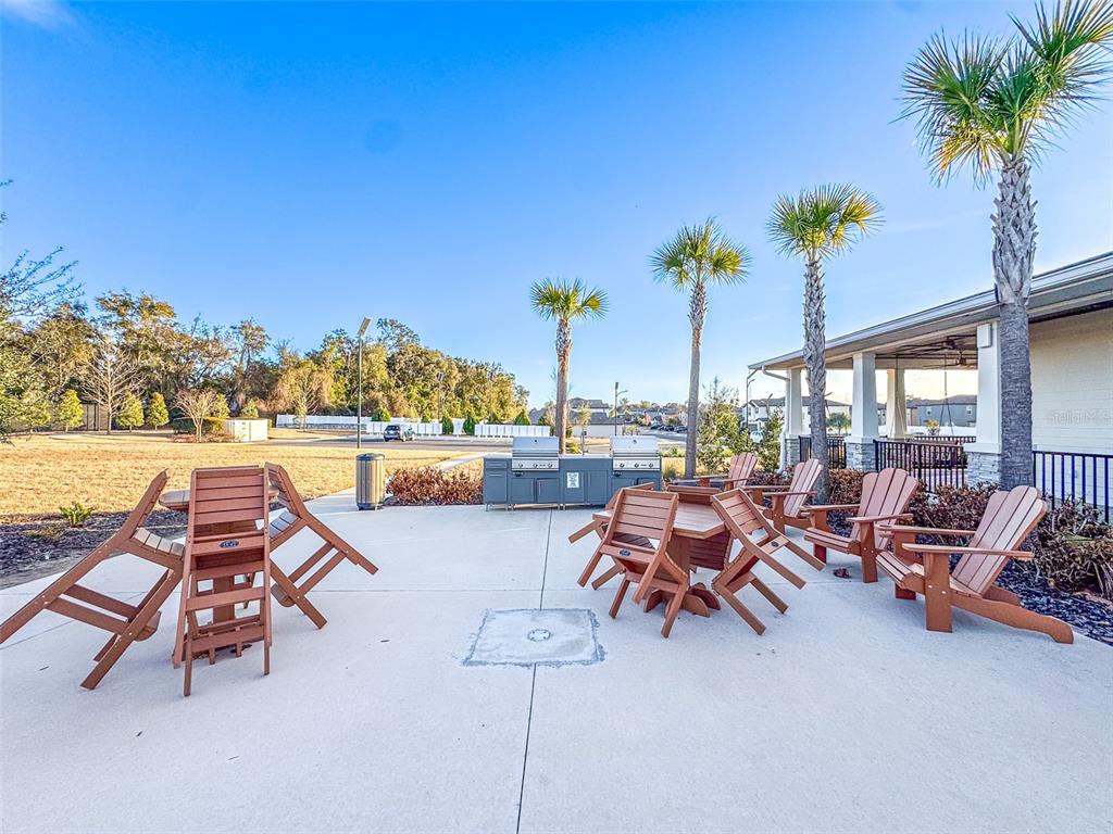 7014 Ripple Pond Loop Zephyrhills, FL 33541 - Photo 36 of 40 a outdoor space with furniture and garden view