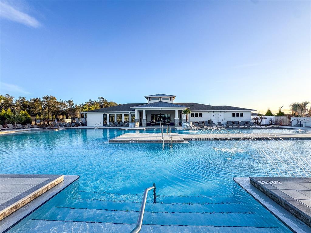 7014 Ripple Pond Loop Zephyrhills, FL 33541 - Photo 37 of 40 a view of a lake with houses
