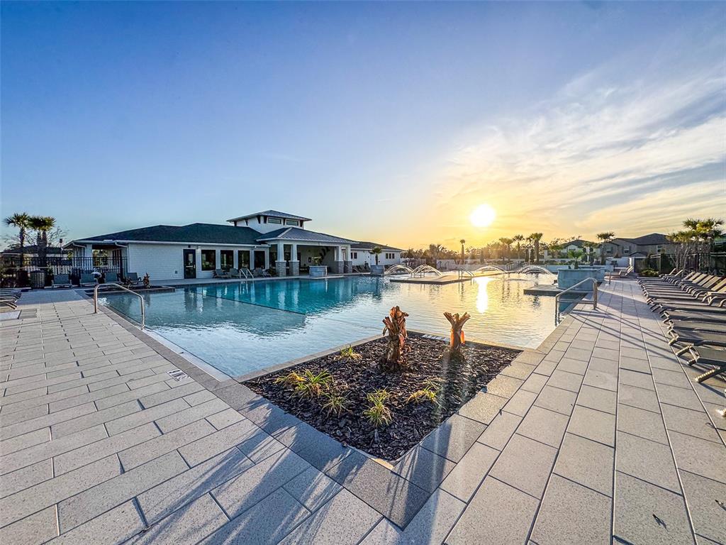 7014 Ripple Pond Loop Zephyrhills, FL 33541 - Photo 38 of 40 a view of a lake with houses