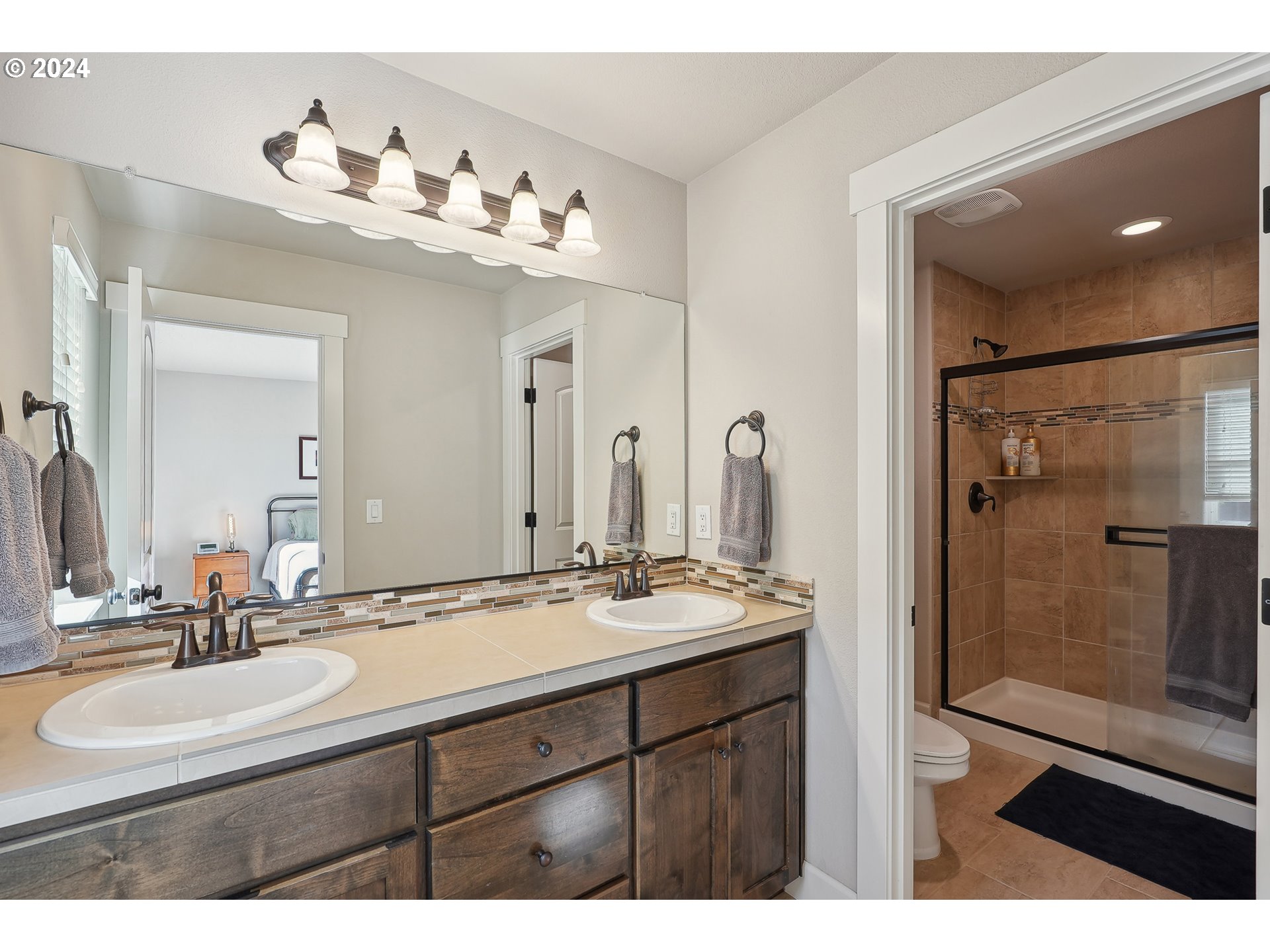 3520 Northeast Spruce Drive Camas, WA 98607 - Photo 24 of 38 a bathroom with a sink vanity and mirror