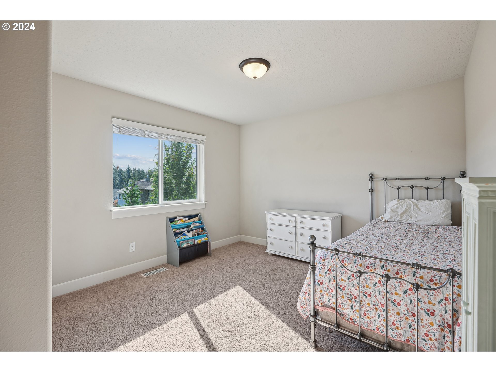 3520 Northeast Spruce Drive Camas, WA 98607 - Photo 26 of 38 a bedroom with furniture and a window