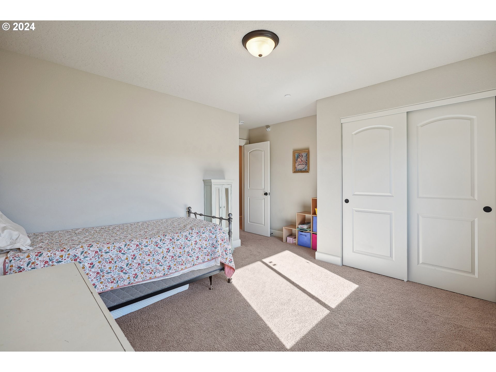 3520 Northeast Spruce Drive Camas, WA 98607 - Photo 27 of 38 a bedroom with a bed and a cabinets