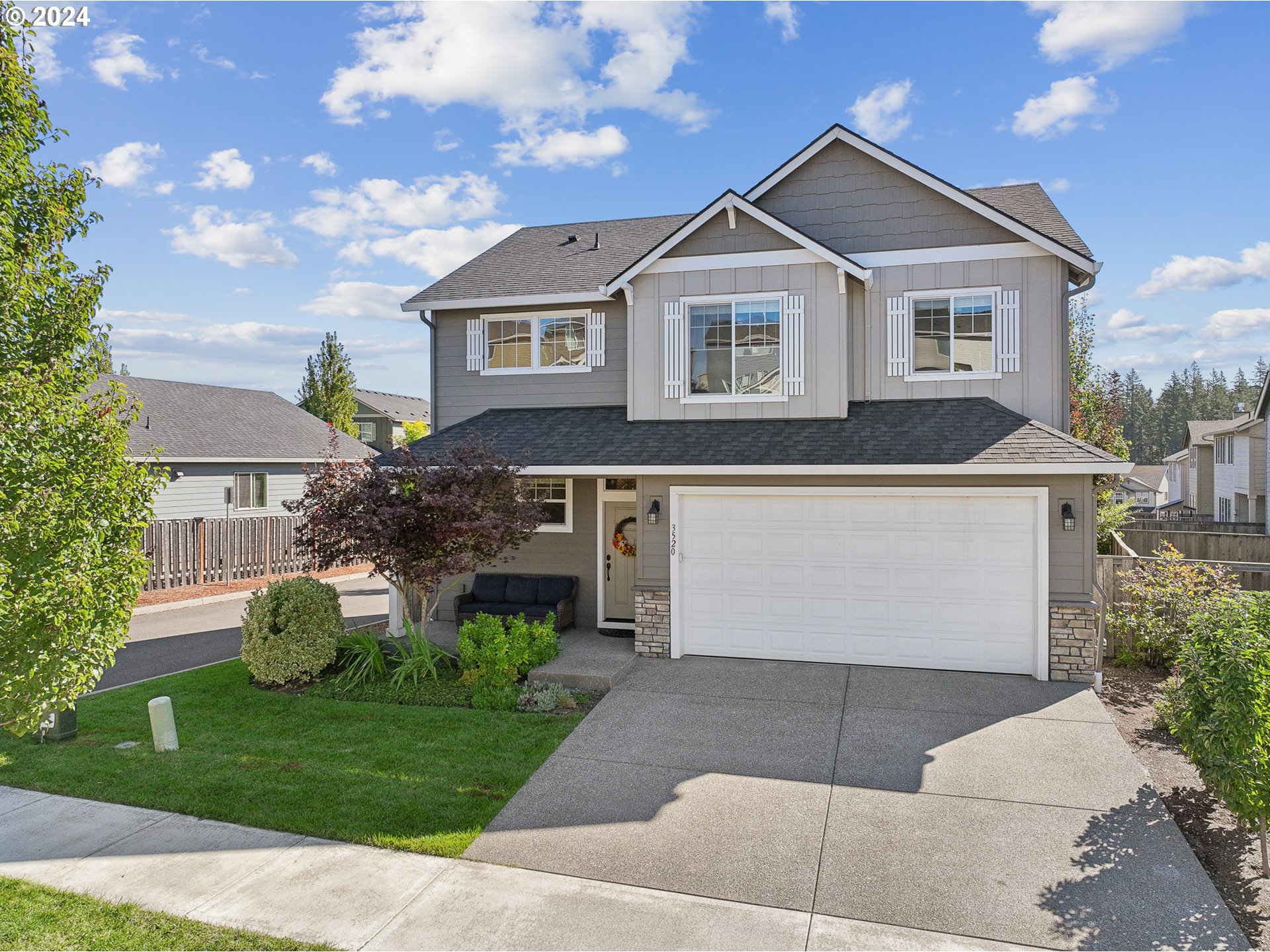 3520 Northeast Spruce Drive Camas, WA 98607 - Photo 3 of 38 a front view of a house with a garden
