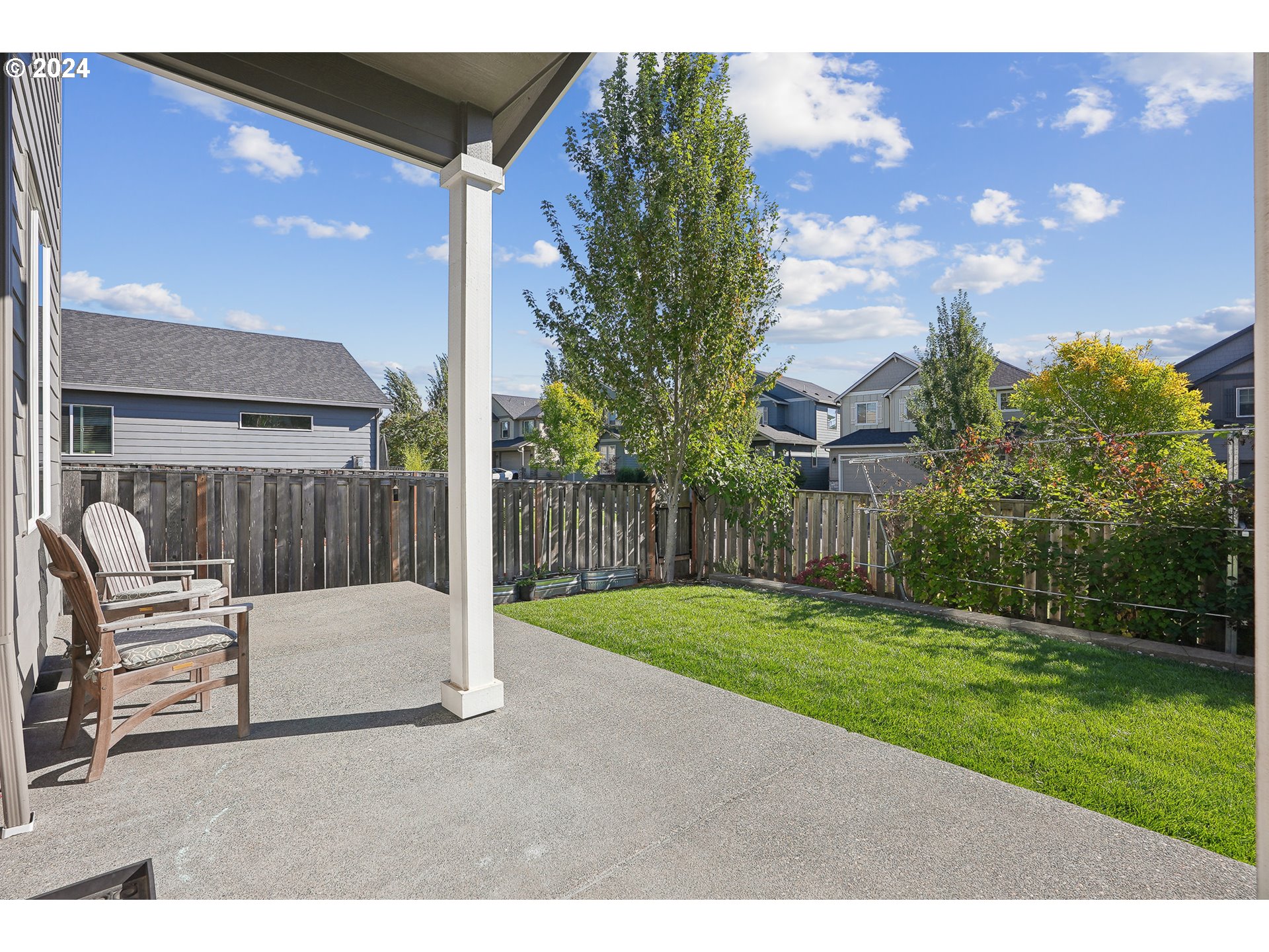 3520 Northeast Spruce Drive Camas, WA 98607 - Photo 31 of 38 a backyard of a house with table and chairs