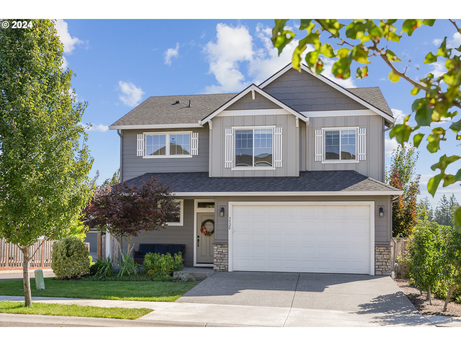 3520 Northeast Spruce Drive Camas, WA 98607 - Photo 37 of 38 a front view of a house with a yard and garage