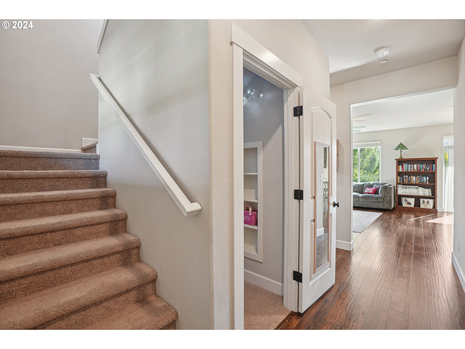 3520 Northeast Spruce Drive Camas, WA 98607 - Photo 5 of 38 a view of a livingroom with wooden floor and stairs