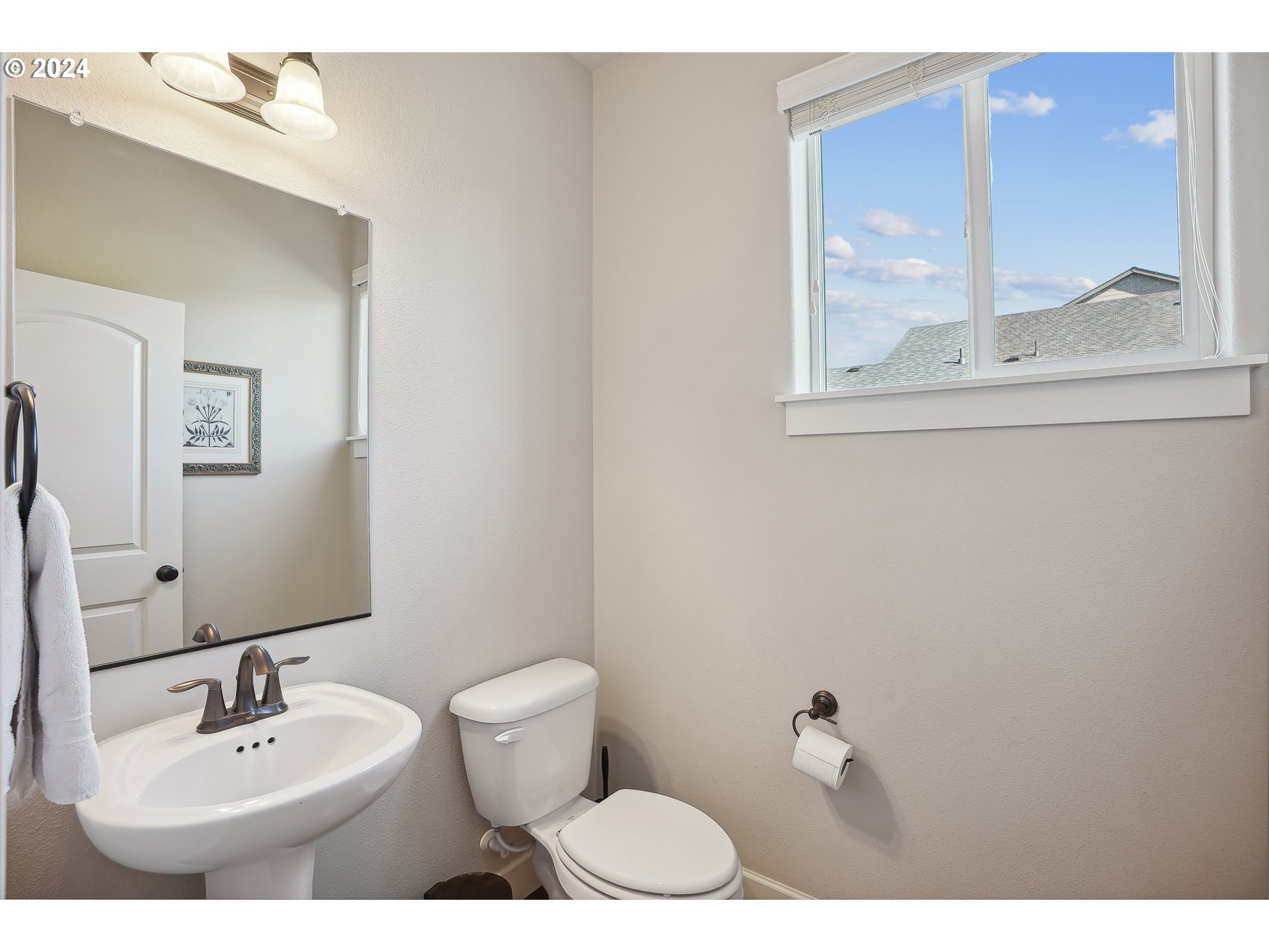 3520 Northeast Spruce Drive Camas, WA 98607 - Photo 8 of 38 a bathroom with a sink mirror and toilet