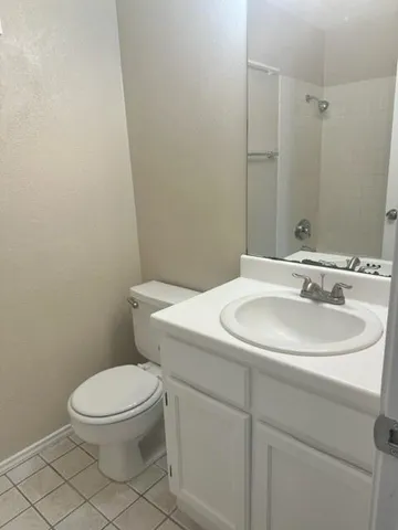 a bathroom with a sink toilet and mirror