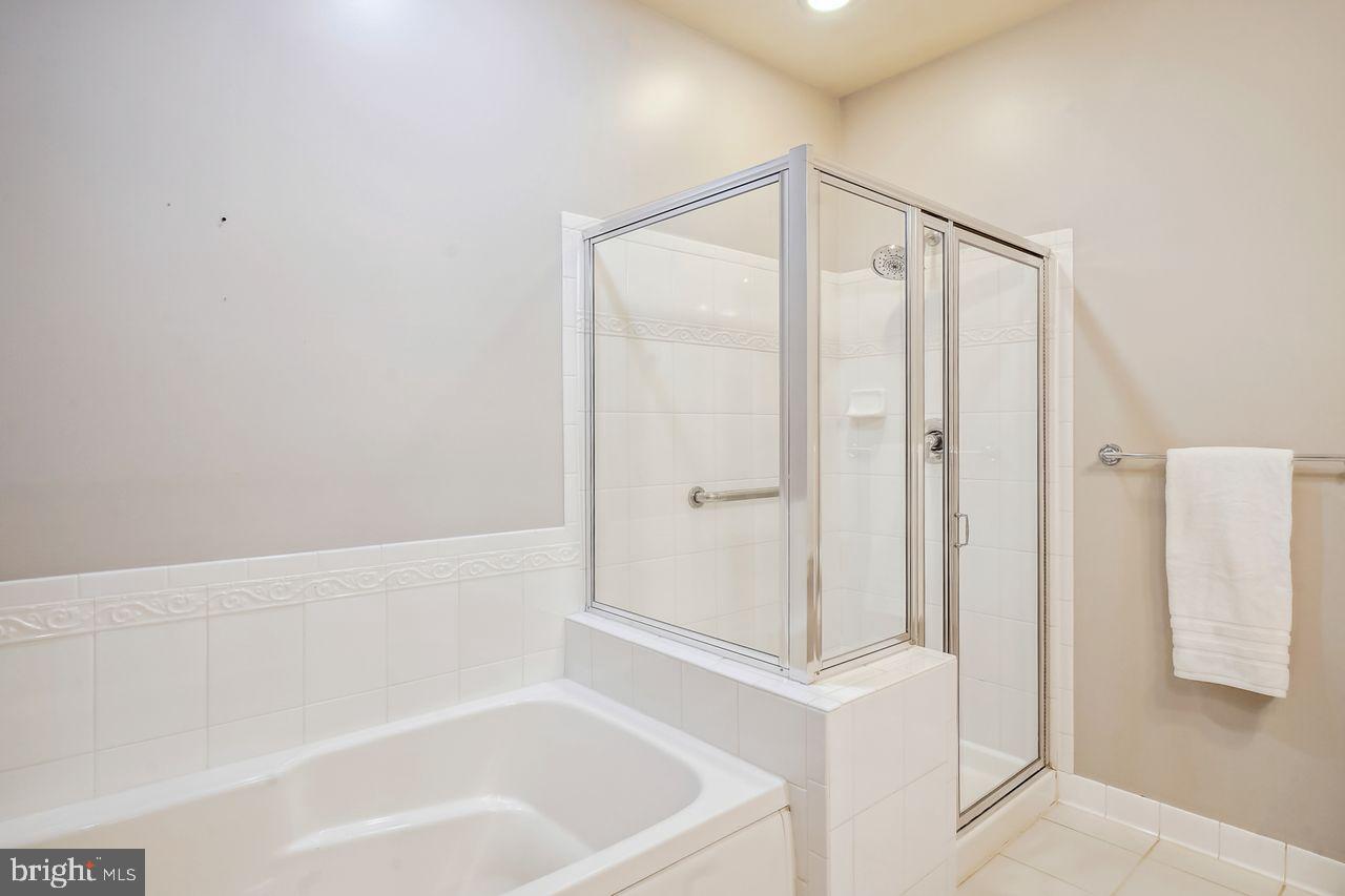 3011 Sanctuary Lane Frederick, MD 21701 - Photo 19 of 41 Primary Bathroom with shower and tub