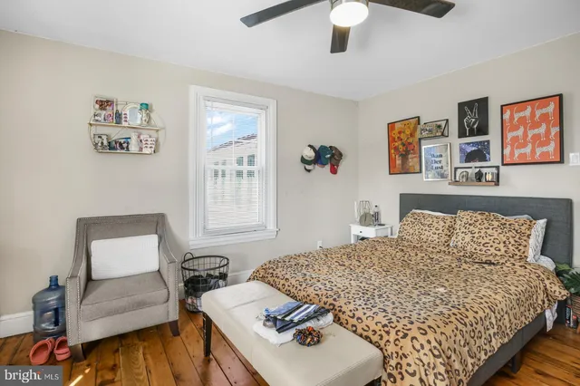 a bedroom with a bed and a couch