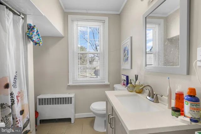 a bathroom with a sink toilet and a bathtub