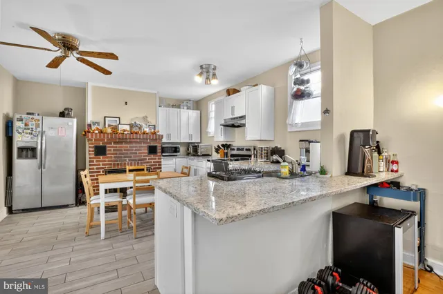 a kitchen with a sink cabinets and window