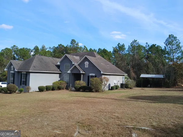 a house with trees in the background
