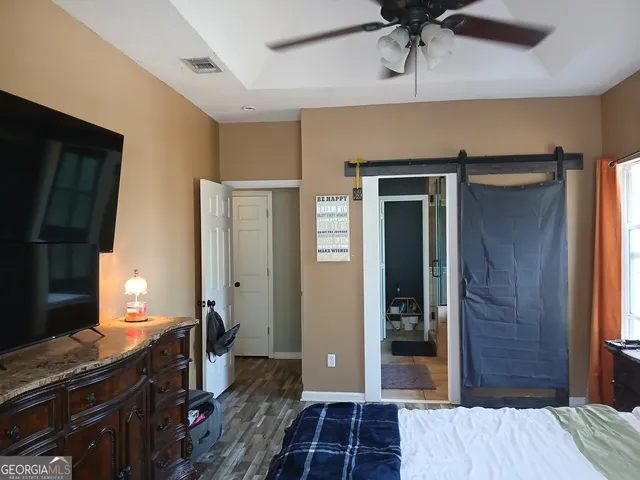 a kitchen with stainless steel appliances granite countertop a stove a refrigerator and a dining table