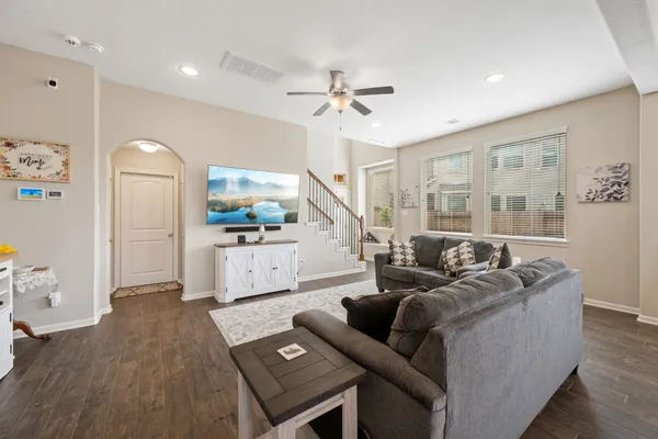 a living room with furniture and a large window