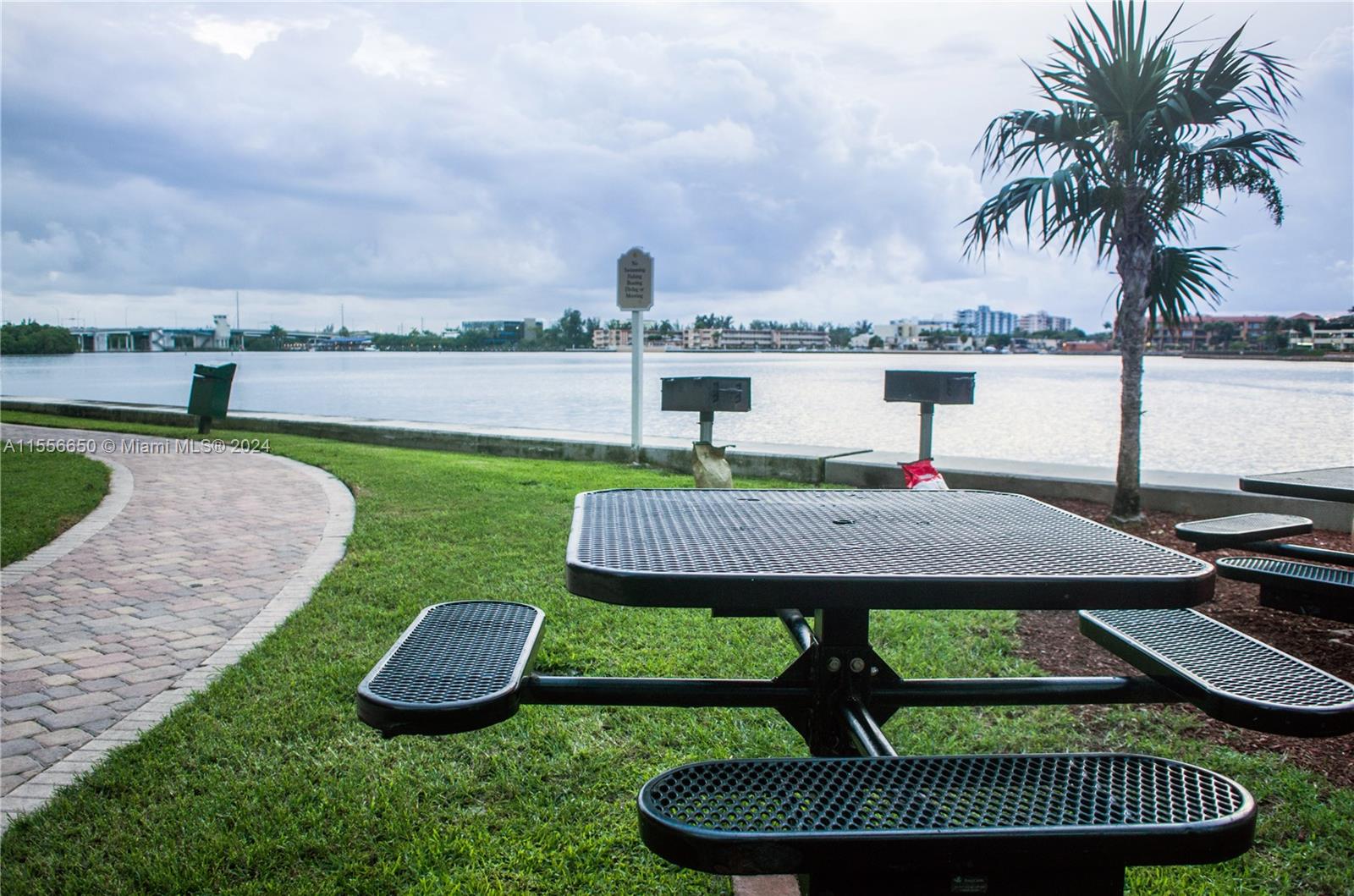 17100 North Bay Road, Unit 1402 Sunny Isles Beach, FL 33160 - Photo 4 of 25 a view of a table and chairs in patio of the house