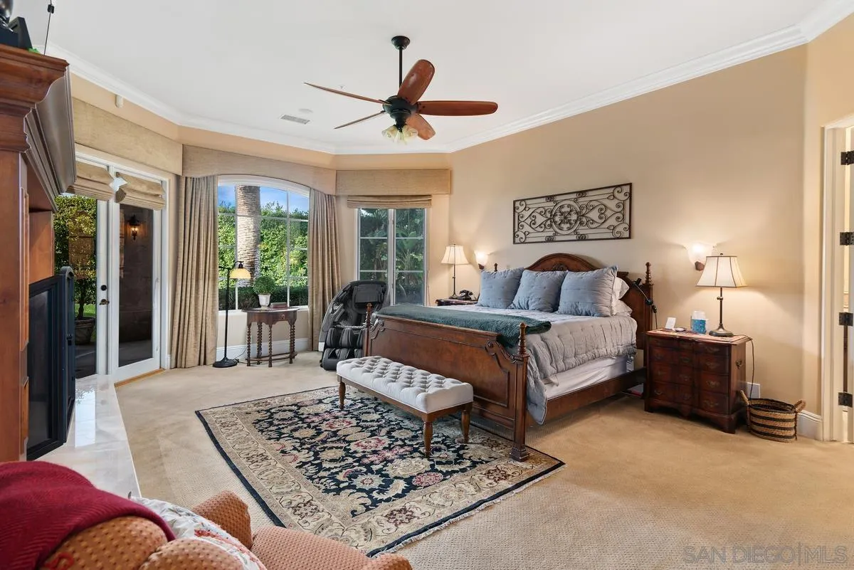 14360 Ciera Court Poway, CA 92064 - Photo 15 of 29 a bedroom with a bed a couch and a large window