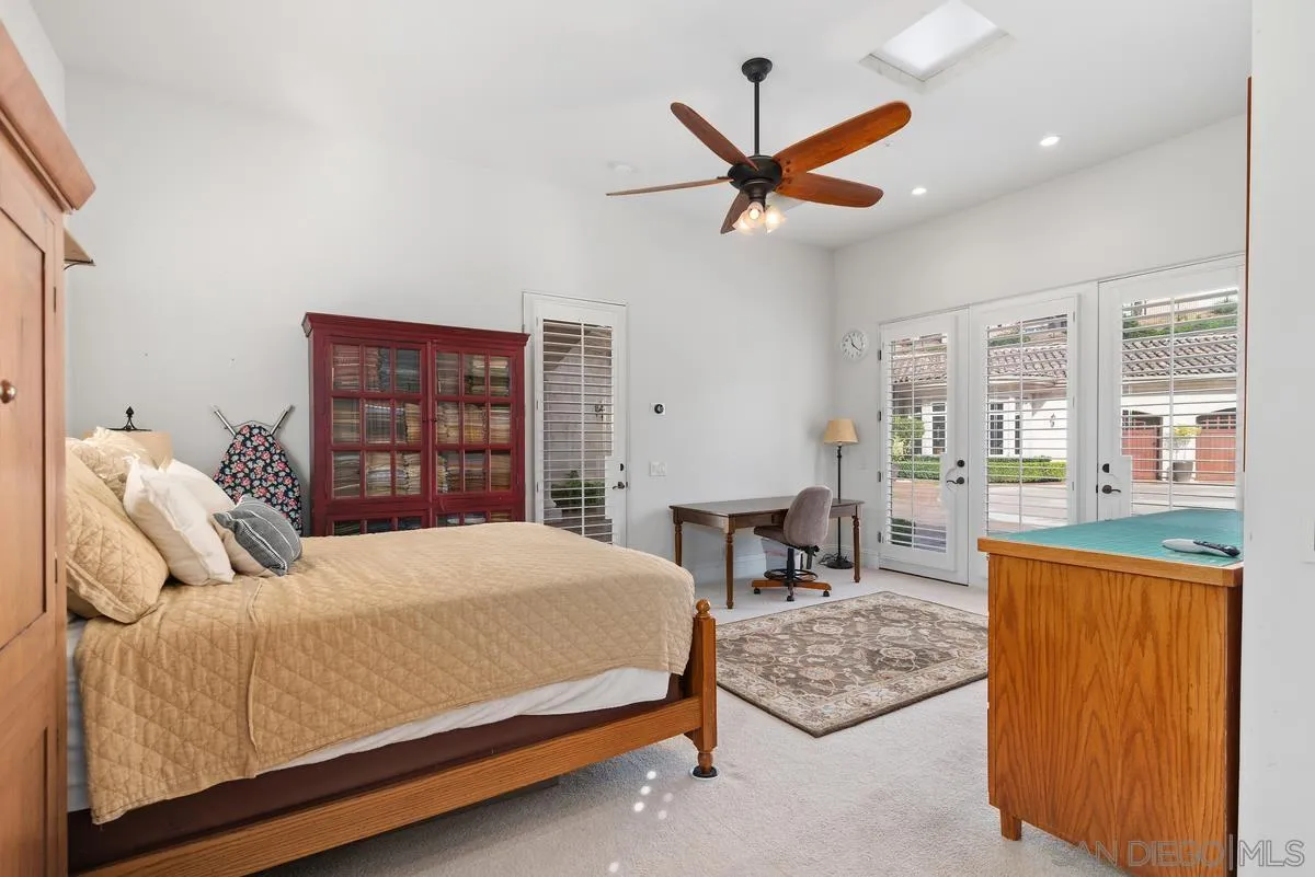 14360 Ciera Court Poway, CA 92064 - Photo 25 of 29 a bedroom with a bed a dresser and a large window