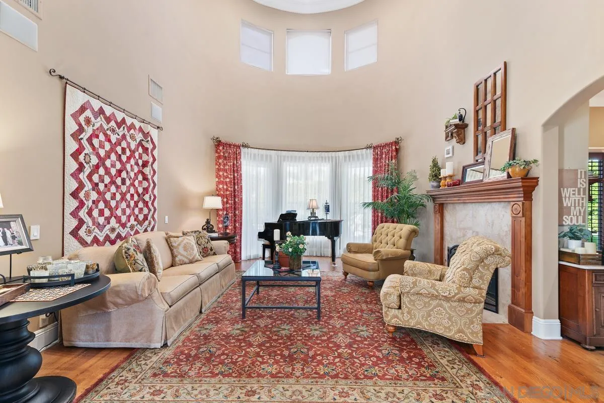 14360 Ciera Court Poway, CA 92064 - Photo 5 of 29 a living room with furniture a rug and a fireplace